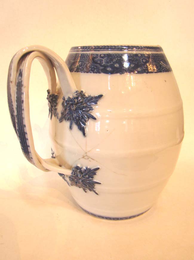 A late 18th century Chinese Export Porcelain Cider Jug with condition issues